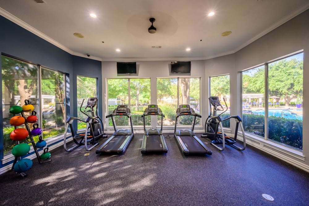 Treadmills and more in the fitness center at 23Hundred @ Ridgeview in Plano, Texas