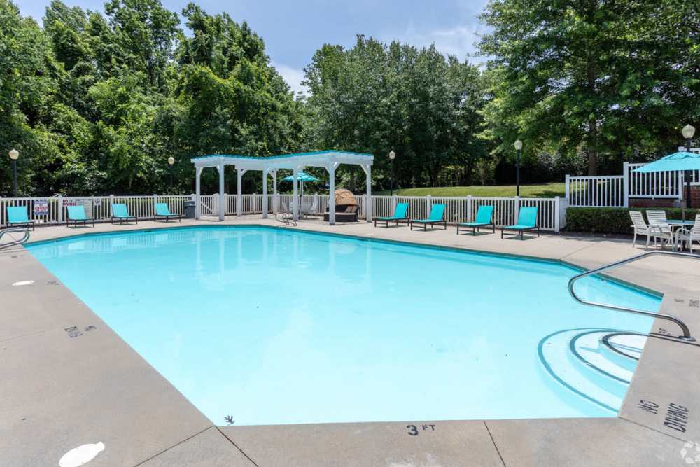 Resident pool with pool side lounge chairs at Heritage in Hillsborough, North CarolinaResident pool with pool side lounge chairs at Heritage in Hillsborough, North Carolina