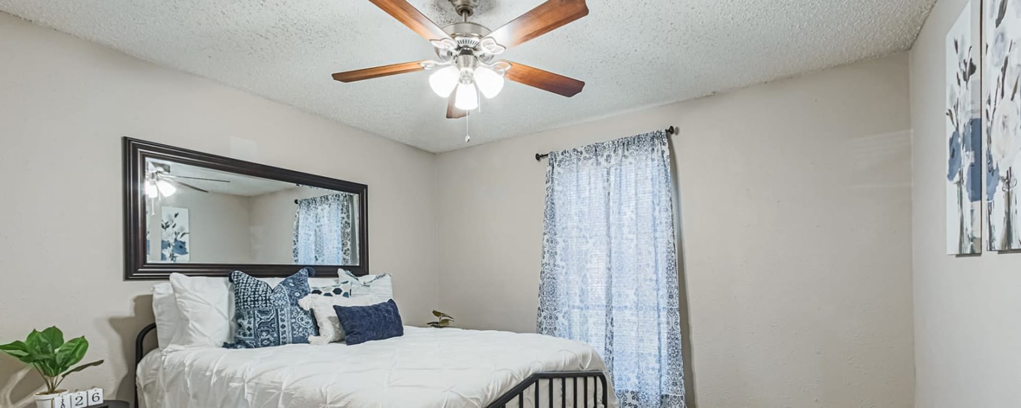 Bedroom with a ceiling fan at Retreat at 2818 in Bryan, Texas