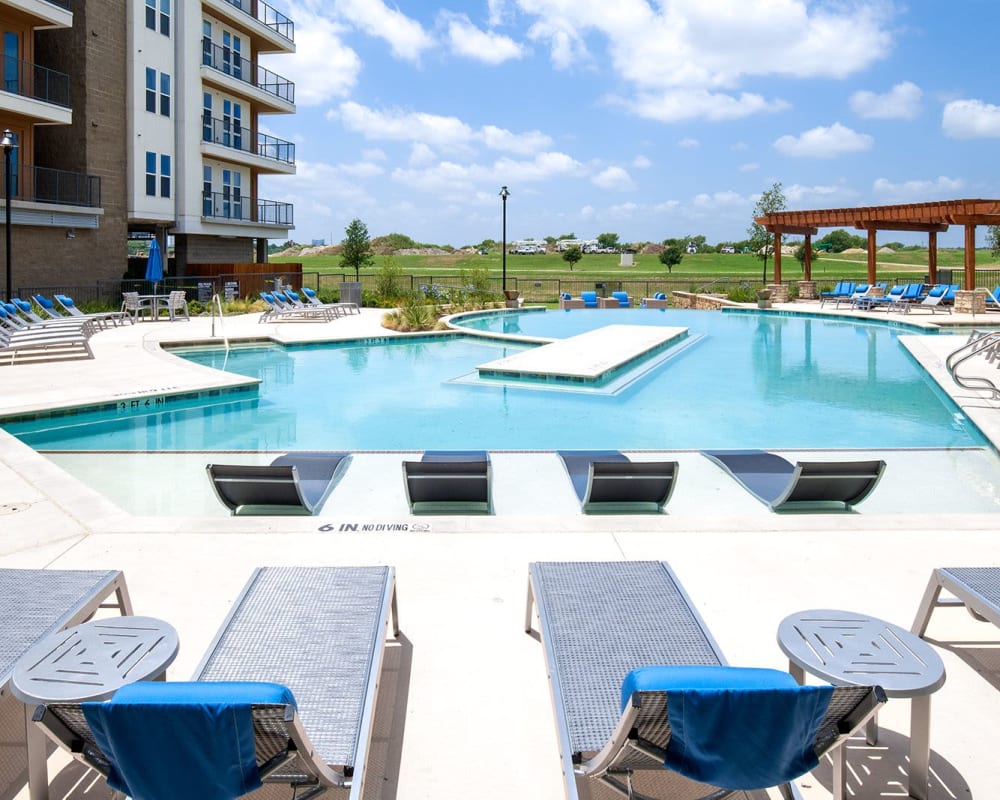 Resort-style swimming pool and sundeck at a luxury community by Electra America in Lake Park, Florida