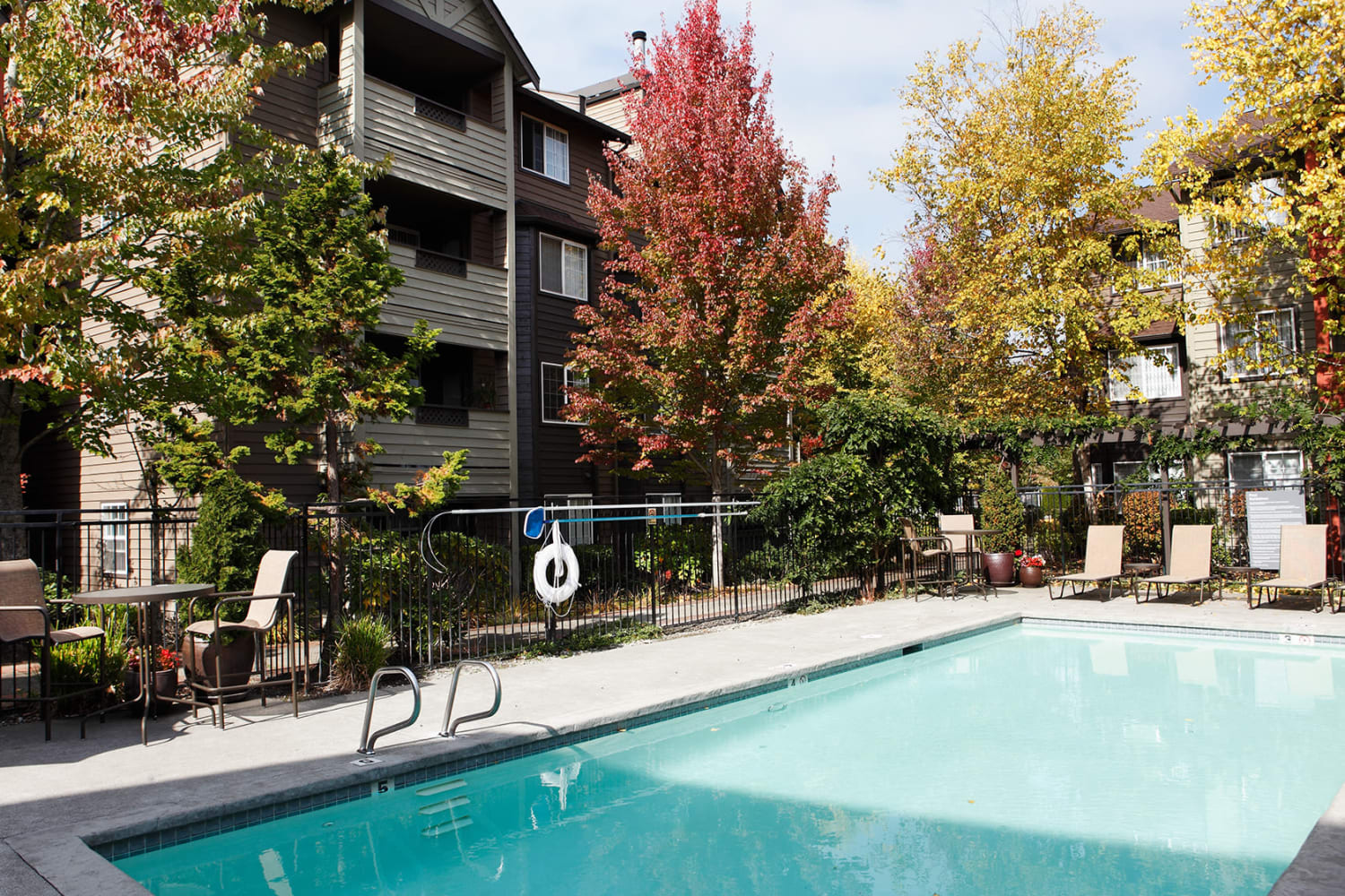 Poolside lounge area at Redmond Place Apartments in Redmond, Washington