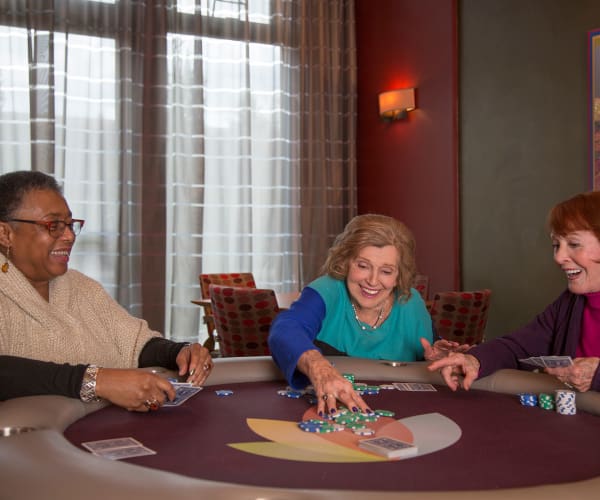 Residents playing a game of cards at All Seasons West Bloomfield in West Bloomfield, Michigan