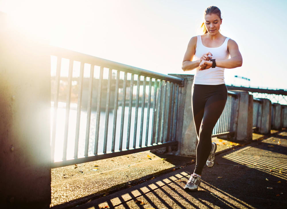 A women on a jog along the waterfront near Lakefront on Washington in Seattle, Washington