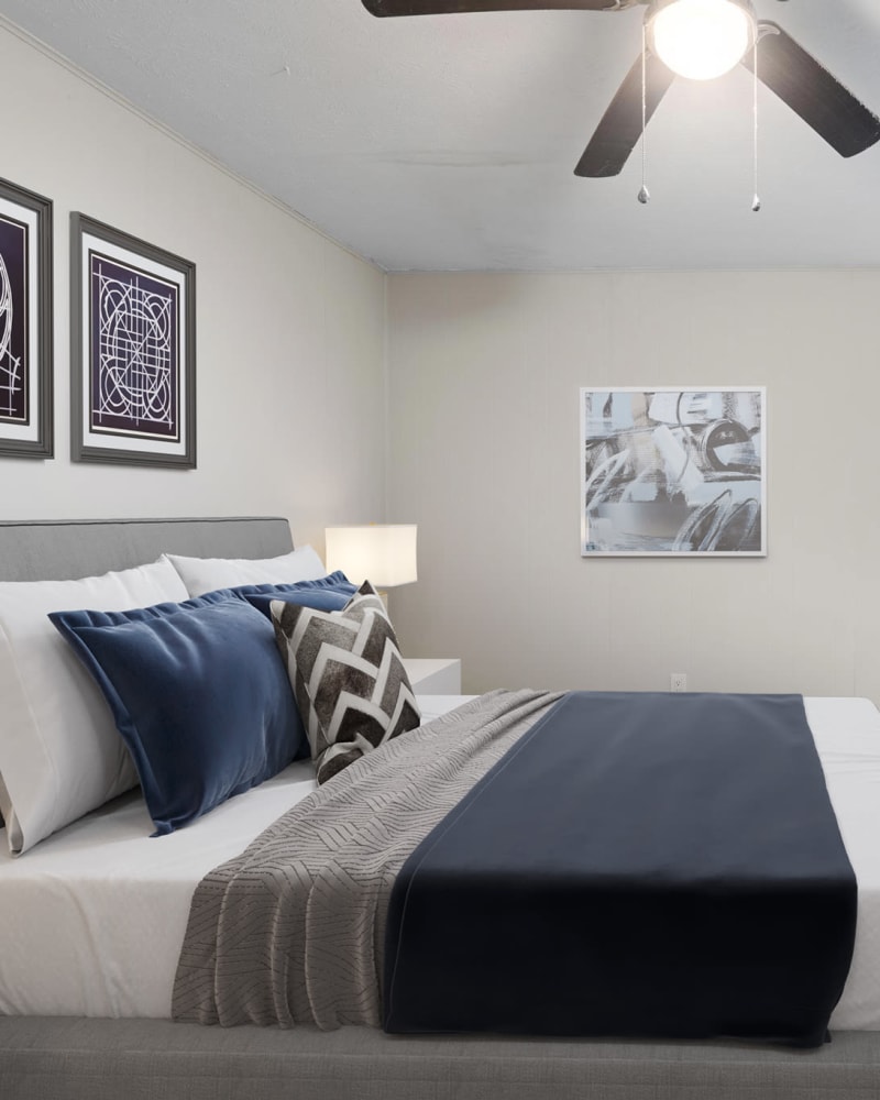 A model apartment bedroom at Spring Creek Apartment Homes in Decatur, Georgia at dusk