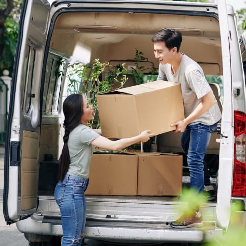  a couple loads a van with boxes to be stored at Red Dot Storage in North Little Rock, Arkansas