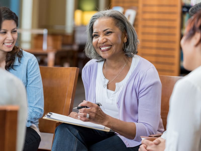 A smiling staff member at Maple Ridge Senior Living in Ashland, Oregon. 