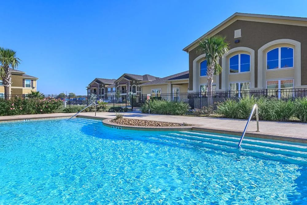 Resort-style pool at Garden Style community at Villas On Independence in Port Lavaca, Texas