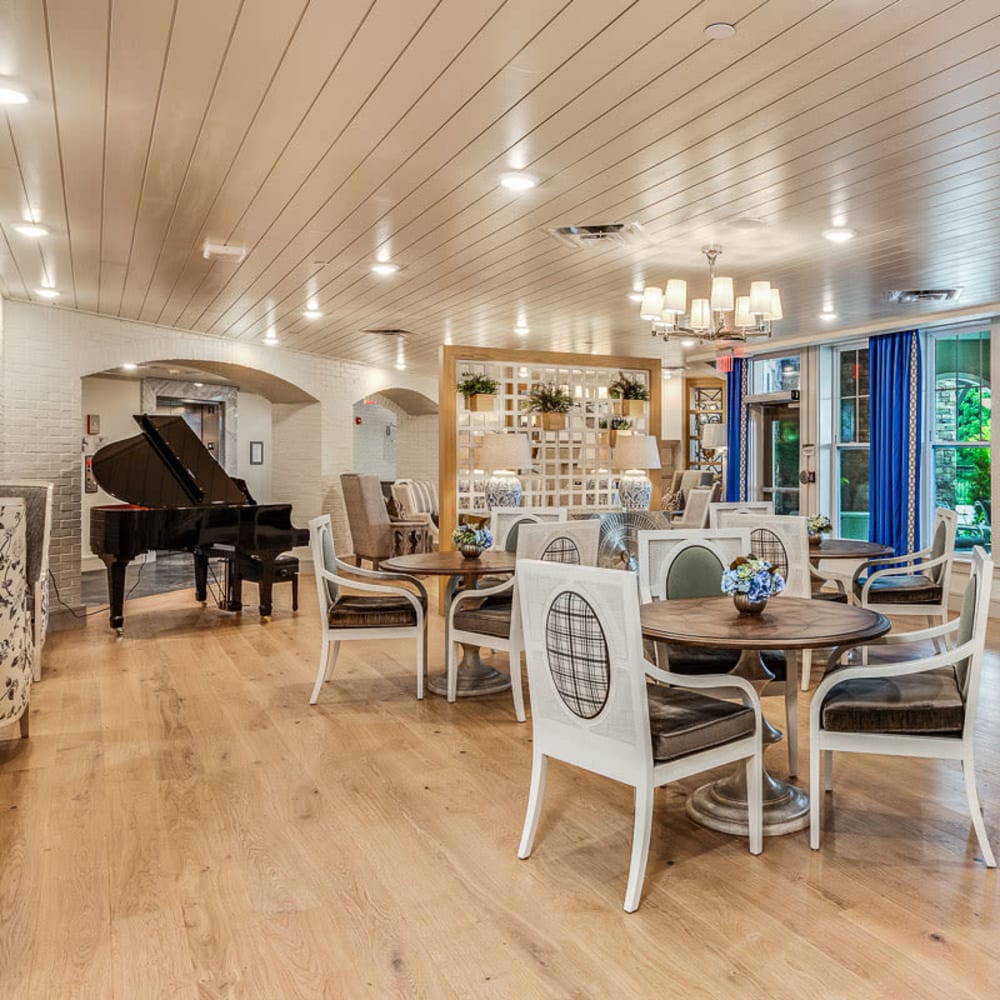 Community room with piano and plenty of seating at Anthology of Louisville in Louisville, Kentucky