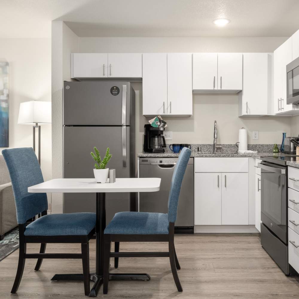 Kitchen with refrigerator at WaterWalk Minneapolis - Plymouth in Plymouth, Minnesota