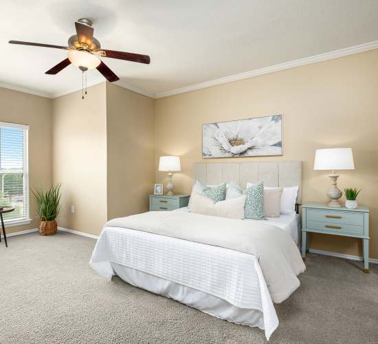 Bedroom with ceiling fan at Villas at Oakwell Farms in San Antonio, Texas