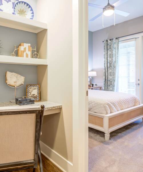 Bedroom with plush-carpeting at The Heyward in Charleston, South Carolina