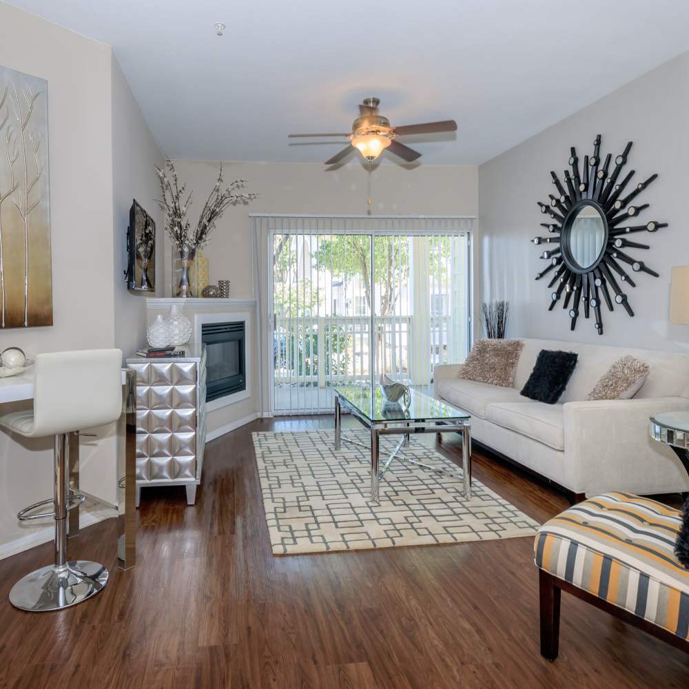 Living room with fireplace at One Belmar Place in Lakewood,Colorado