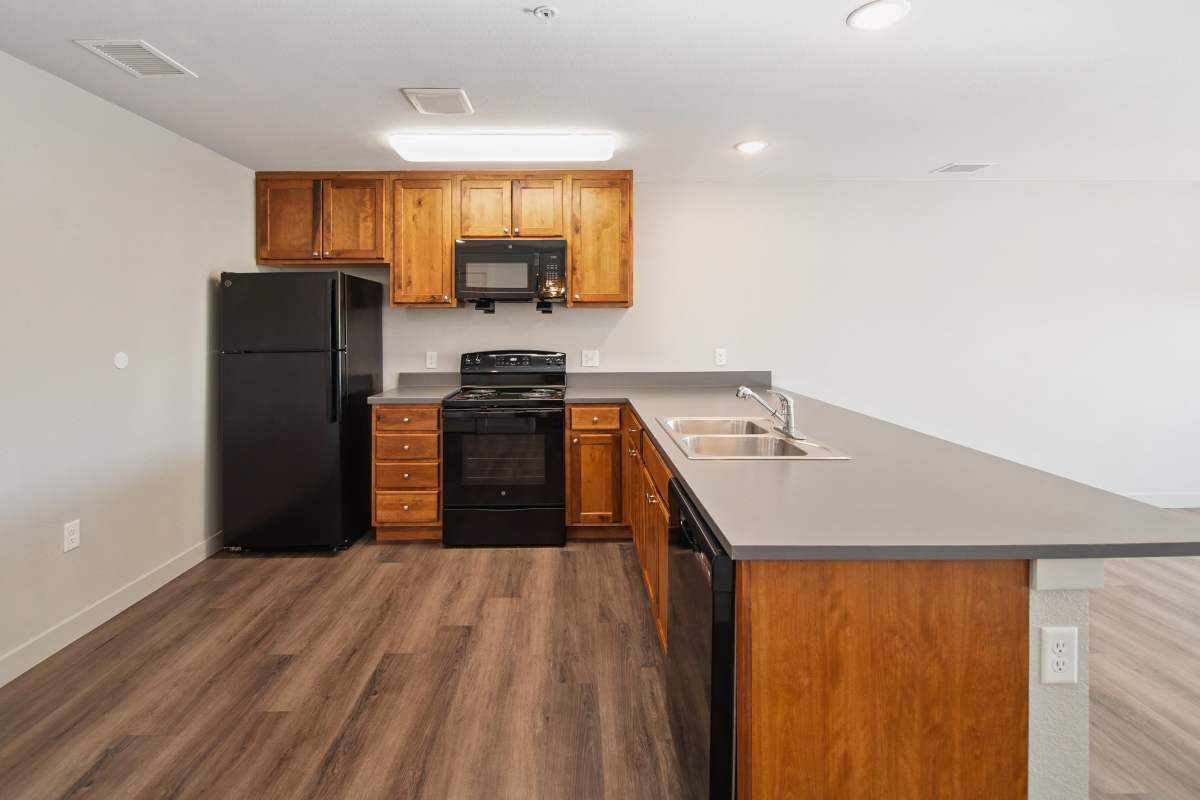 Well-lit apartment kitchen at Villas At Mesa Ridge in Fountain, Colorado