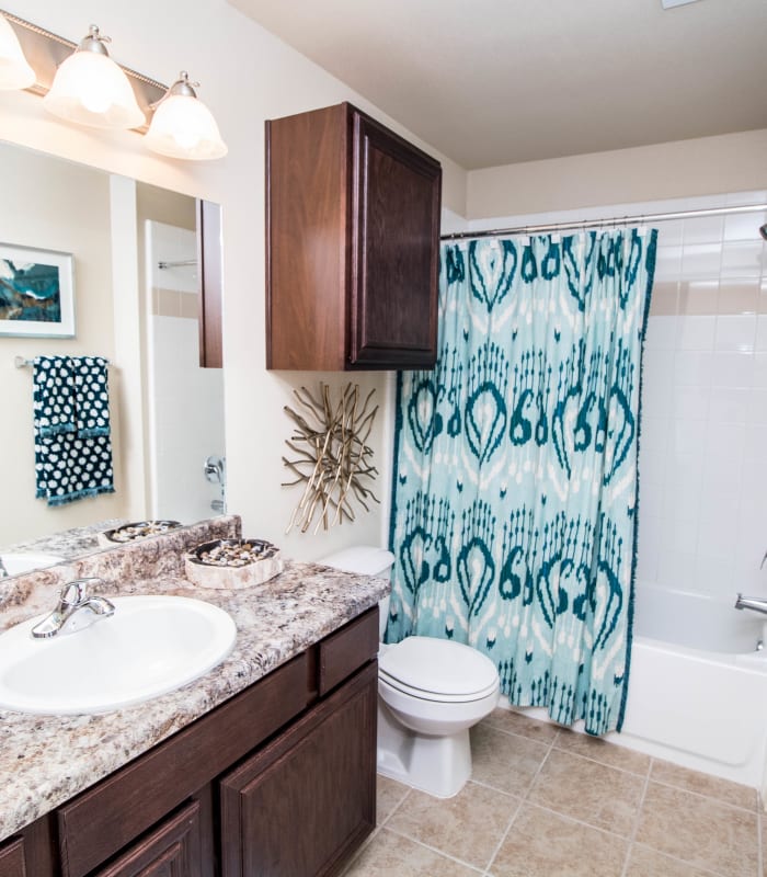 Bathroom with tile flooring at Tuscany Place in Lubbock, Texas