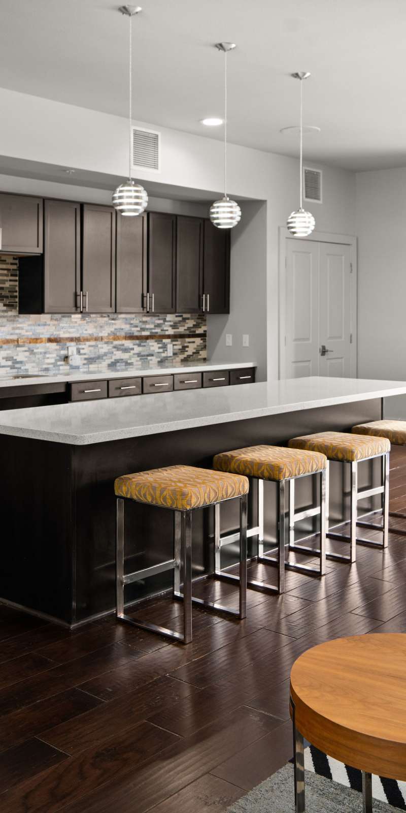 Community kitchen with comfortable seating at The Den in Columbia, Missouri