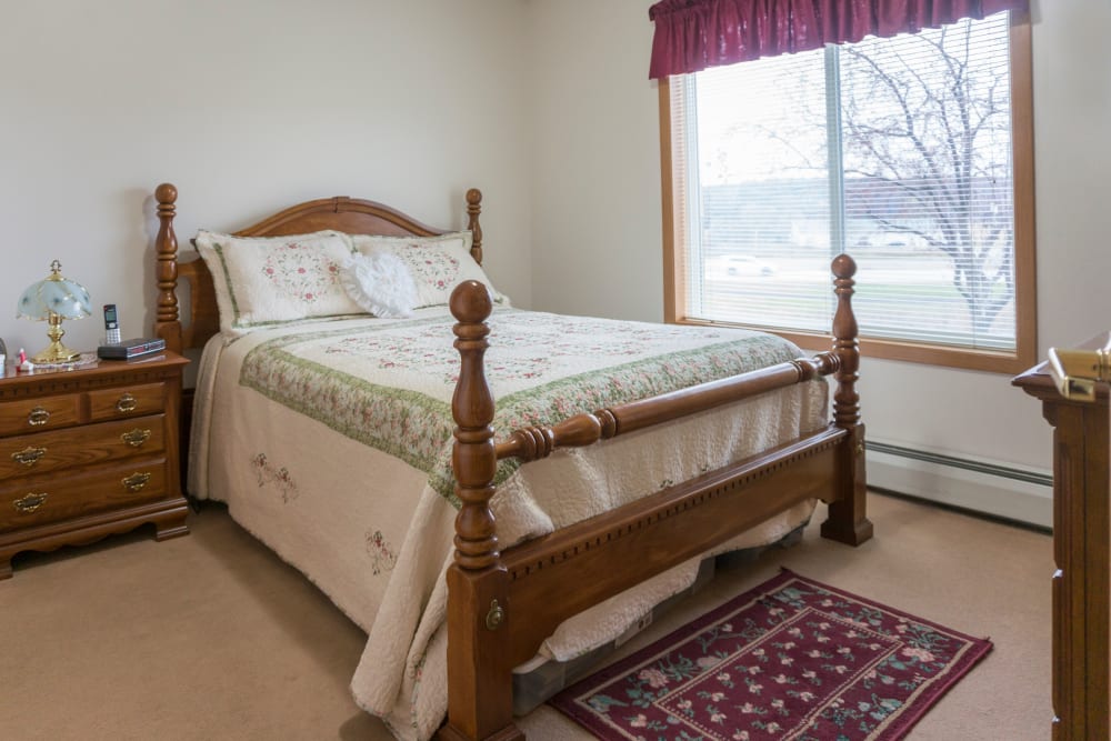 Spacious private resident bedroom at Meadow Lakes Senior Living in Rochester, Minnesota.