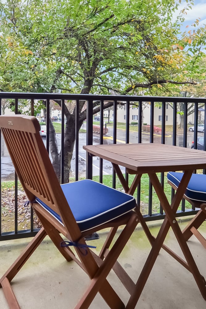 Private balcony with seating at Chesterfield Apartment Homes in Levittown, Pennsylvania