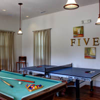 A billiards table and ping pong table in the clubhouse at Evergreen at Five Points in Valdosta, Georgia