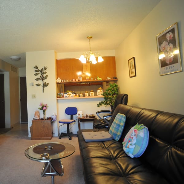 Living room and pass-through to the kitchen of a model apartment at Glendora Gardens in Glendora, California