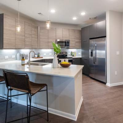 Model kitchen with wood flooring The Jade at Avondale in Decatur, Georgia