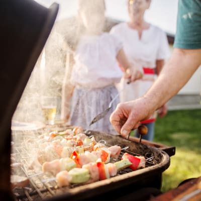 A resident grilling meat at Covenant Trace in Newport News, Virginia