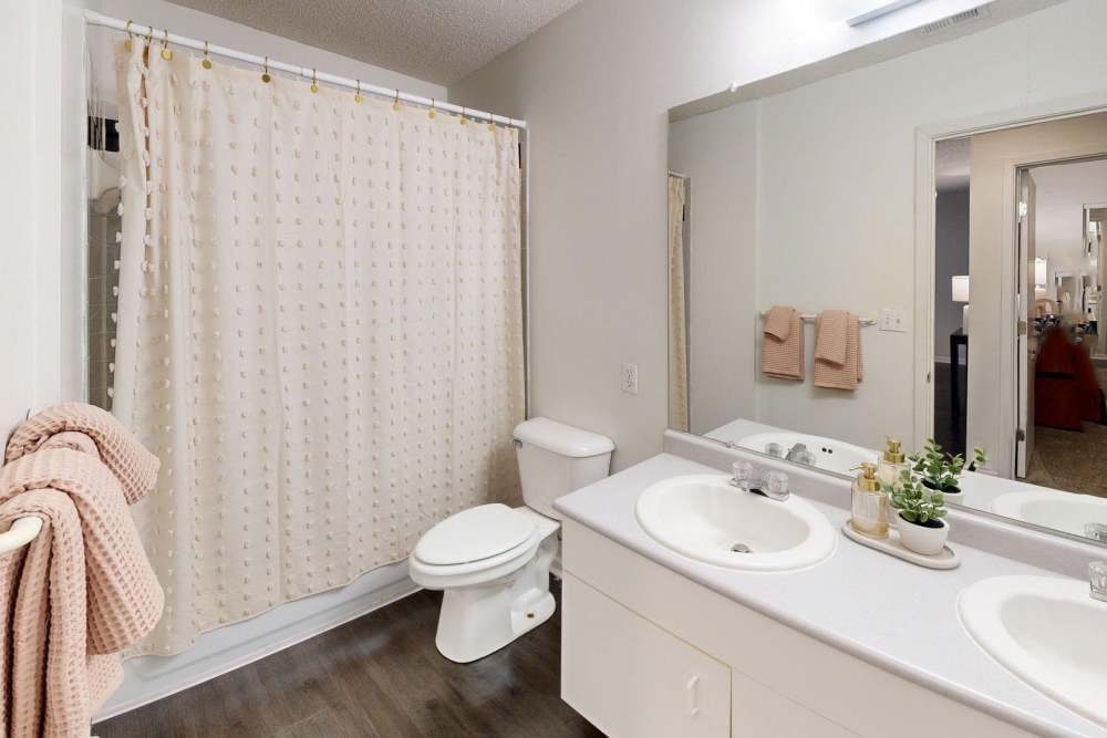Bathroom with large mirror at The Quarters Manhattan in Manhattan, Kansas