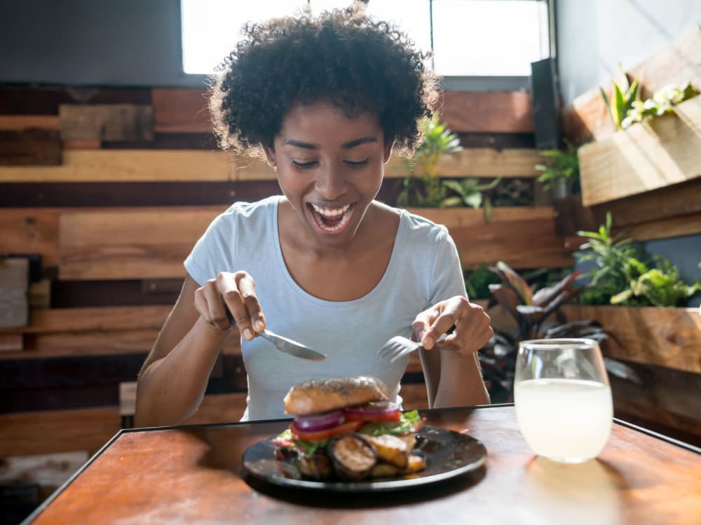 Resident about to dive into her favorite meal at a restaurant near Jade Apartments in Las Vegas, Nevada