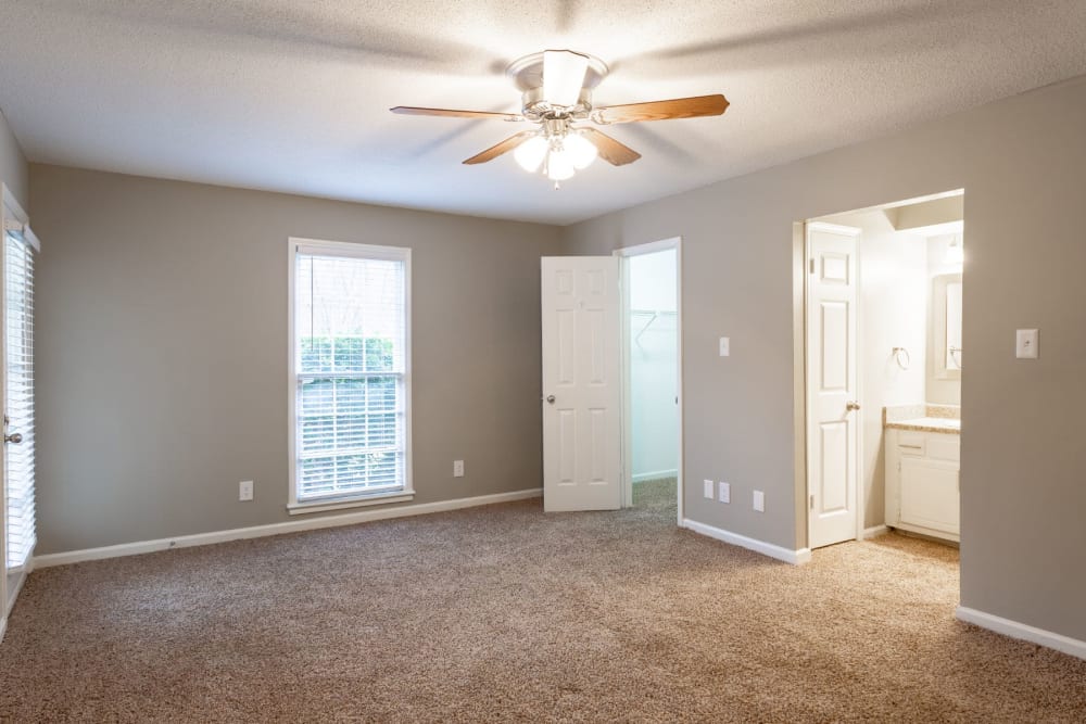 Bedroom with bathroom attached at The Gatsby at Midtown Apartment Living in Montgomery, Alabama