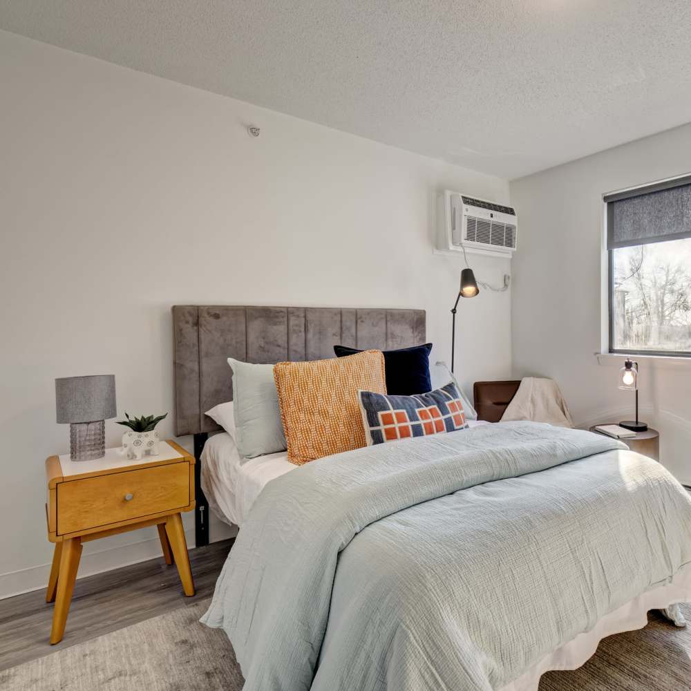 Well-lit modern bedroom at The Otis in Dallas, Texas