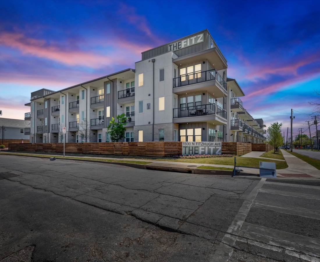 Exterior during night at The Fitz Apartments in Dallas, Texas