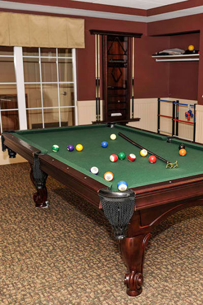 Play billiards with friends at Racquet Club Apartments in Rochester, NY