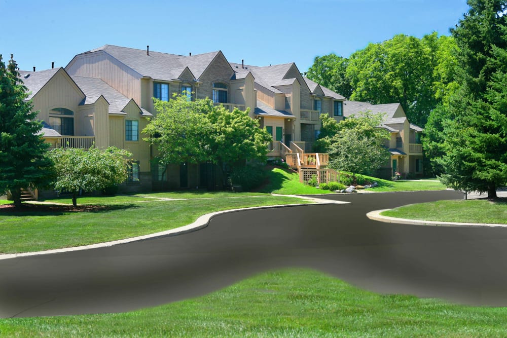 Roads winding through the beautifully maintained neighborhood at Saddle Creek Apartments in Novi, Michigan