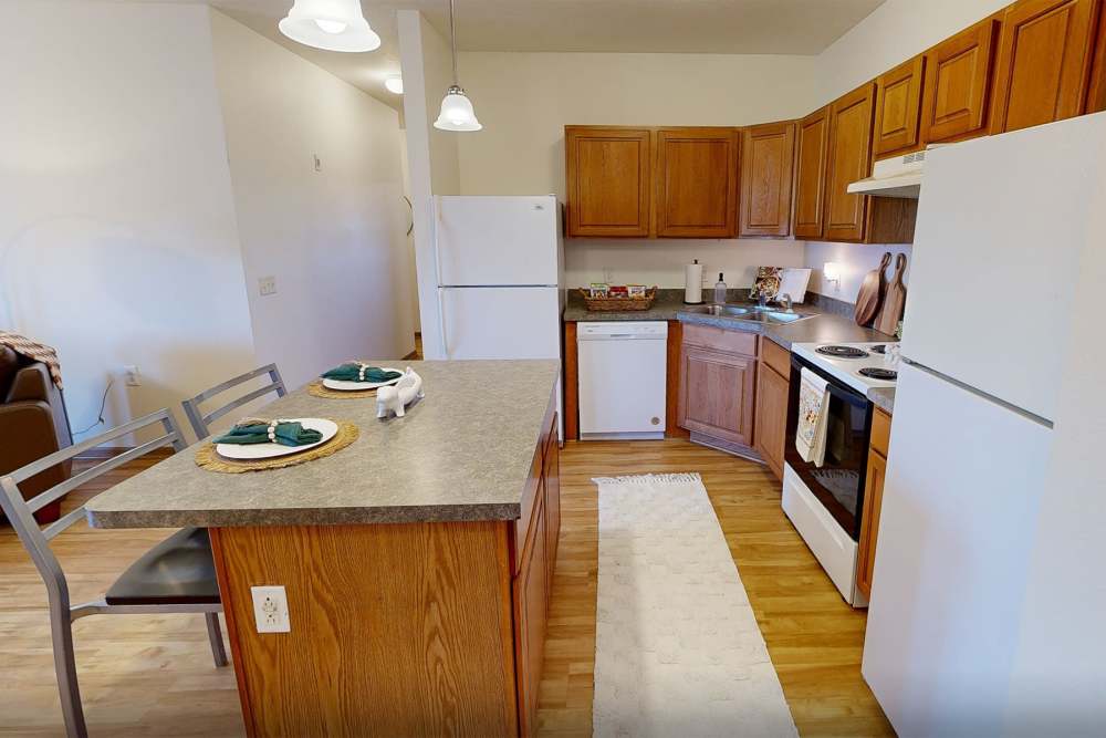 Apartment kitchen with plenty of counter space at The Landing Ames in Ames, Iowa