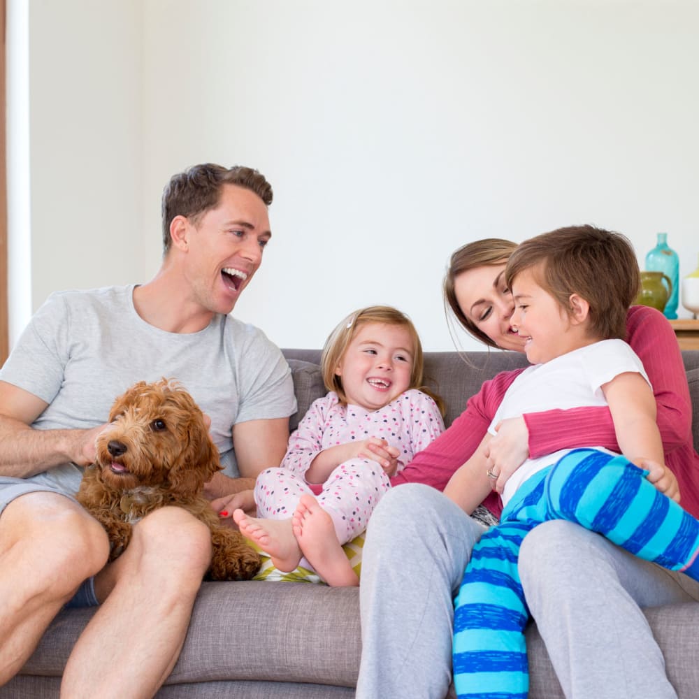 Family laughing at Singh Apartments