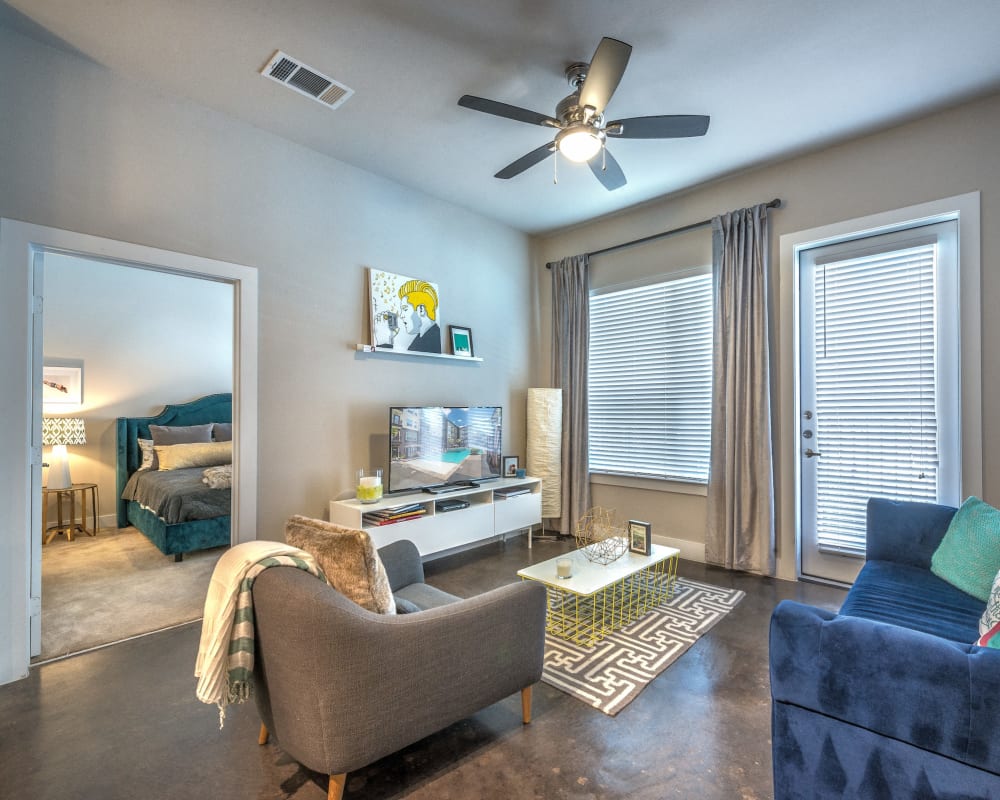 Comfortably decorated living space in a model home at Olympus at Ross in Dallas, Texas