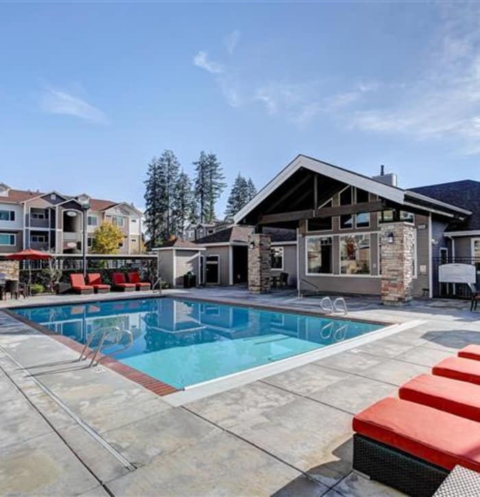 Beautiful swimming pool area at Woodland Apartments in Olympia, WA