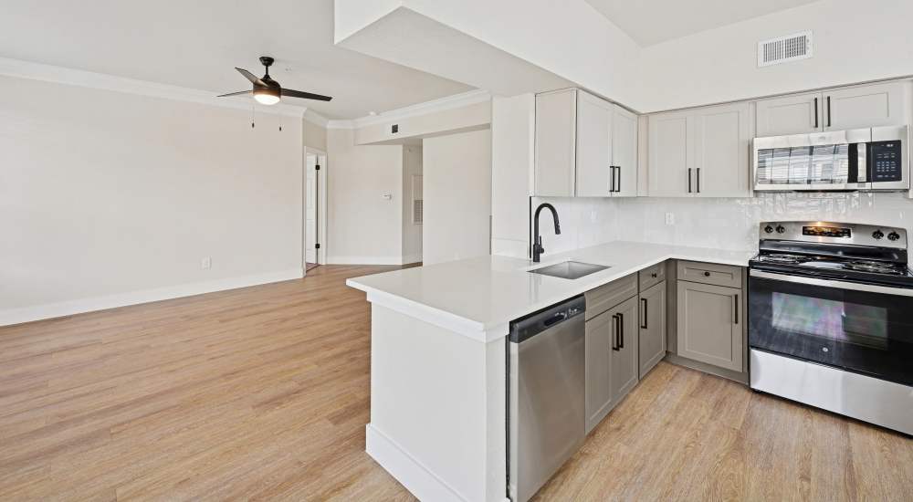 Island kitchen with stainless steel appliances at Barnett in Houston, Texas 