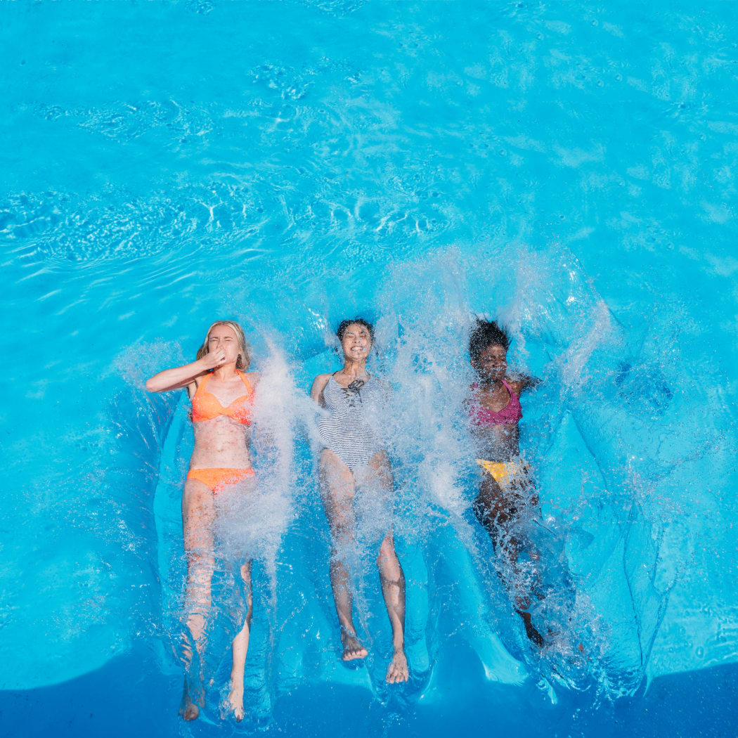 Girls enjoying the refreshing swimming pool at Avilla Lehi Crossing in Mesa, Arizona
