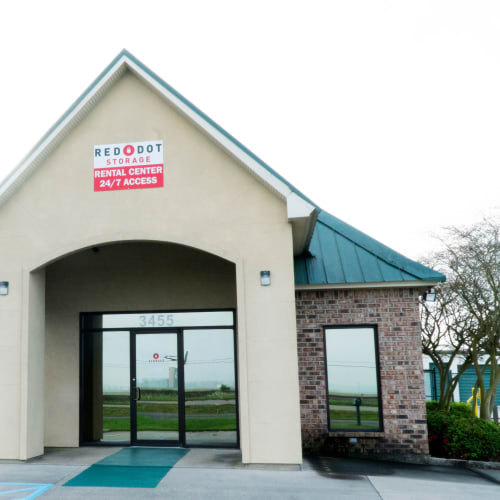 Exterior view of the rental office and outdoor storage units at Red Dot Storage in Port Allen, Louisiana