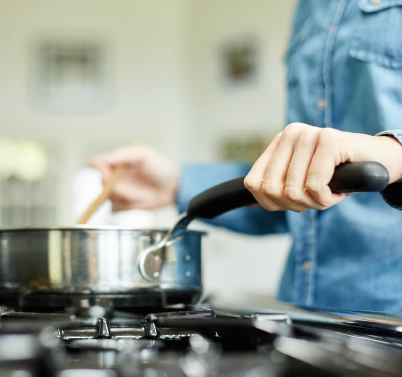 Resident preparing food at Presidential Court in Runnemede, New Jersey