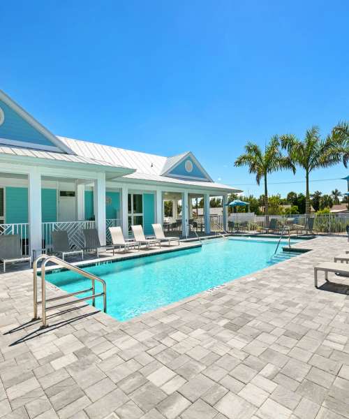 Person swimming underwater in the pool at Lemon Bay Apartments in Englewood, Florida