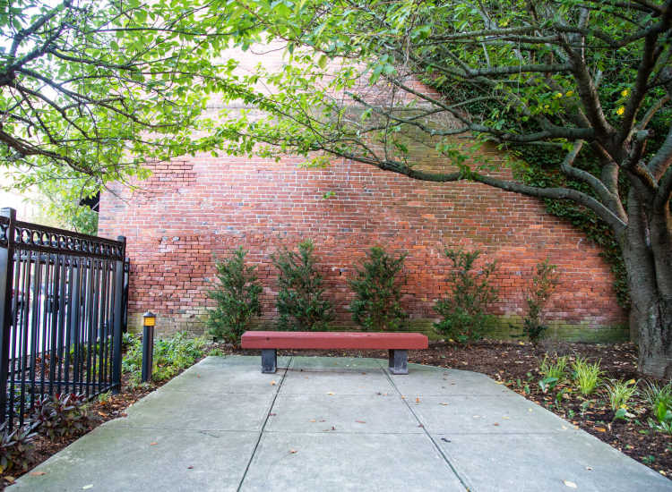 Outdoor seating space at Borden Place Apartments in Fall River, Massachusetts