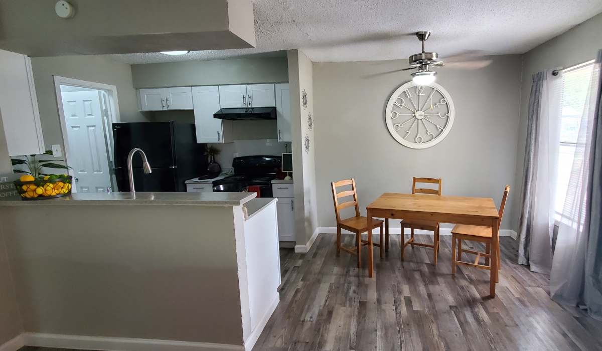 Kitchen with dining table at Villa Nueva in San Antonio, Texas