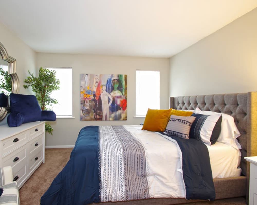 Spacious bedroom with plush carpeting at Old Mill Townhomes in Lynchburg, Virginia