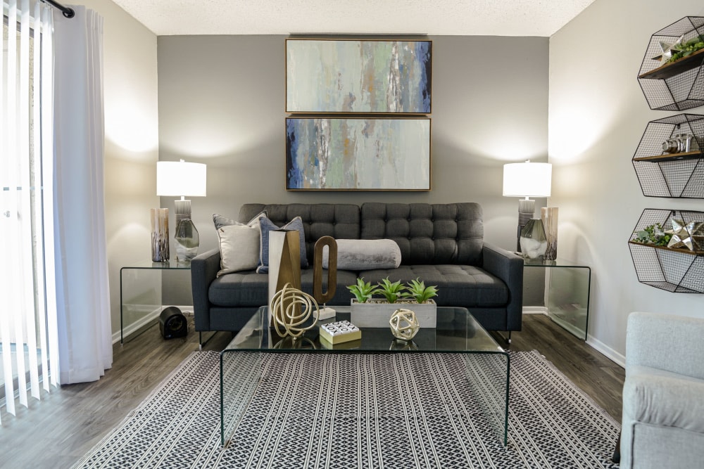 Living room with modern decor at The Regent in Dallas, Texas