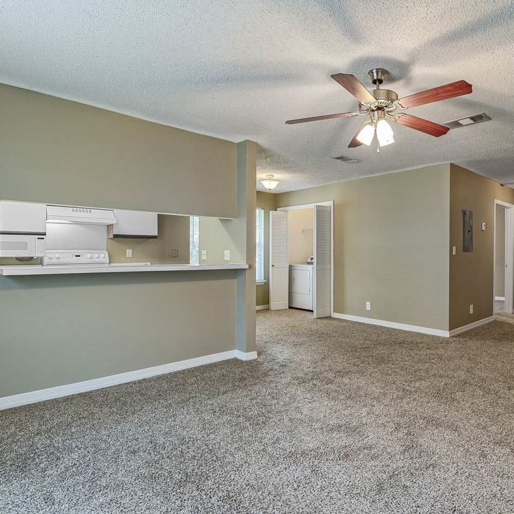 Unfurnished apartment living room with laundry area in the corner at Royal Gulf Apartments in Biloxi,Mississippi
