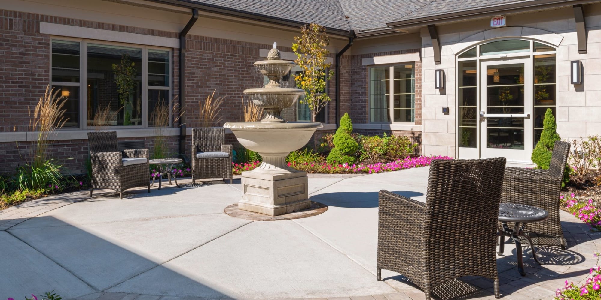 Brightly lit patio with fountain at Blossom Springs in Oakland Twp, Michigan