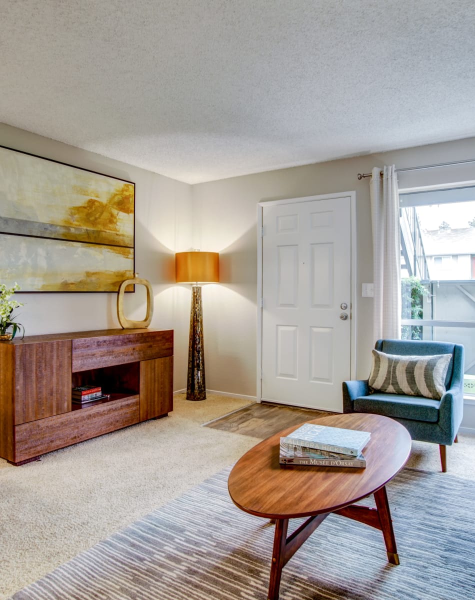 Retro-modern decor and draped windows in a model home's living area at Vue Fremont in Fremont, California