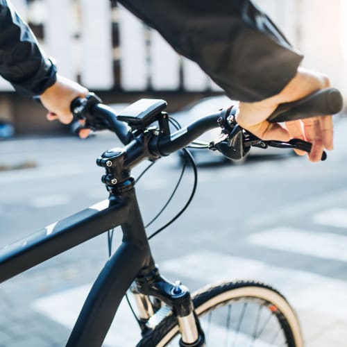 A resident riding a bicycle near South Mesa II in Oceanside, California