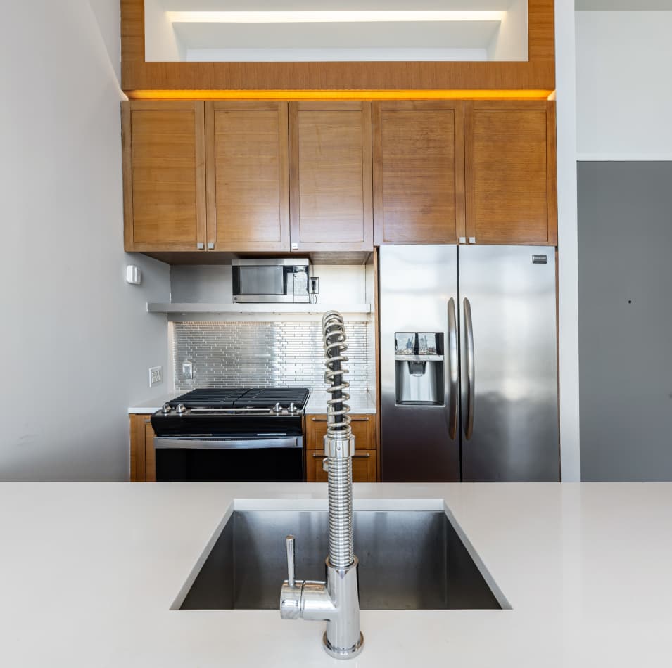 Well-designed apartment kitchen with quartz countertops at The Garnett in Brooklyn, New York